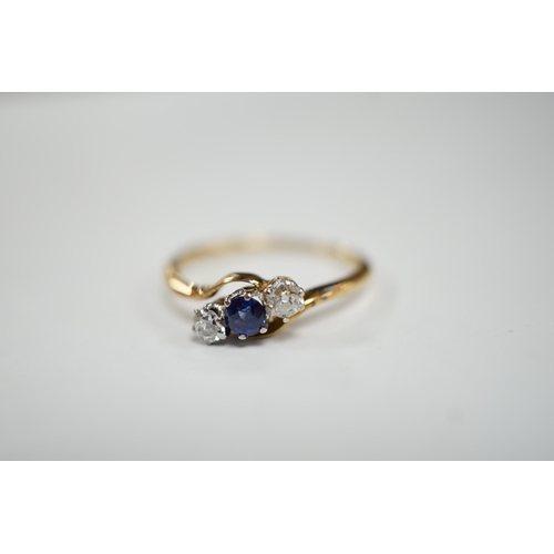 959 - An 18ct, single stone sapphire and two stone diamond set crossover ring, size O, gross weight 2.2 gr... 