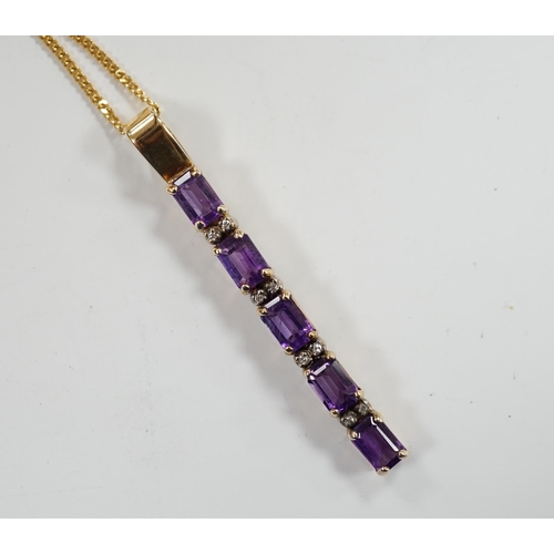 964 - A modern yellow metal, amethyst and diamond chip set line pendant, 47mm, on an 18ct gold fine link c... 