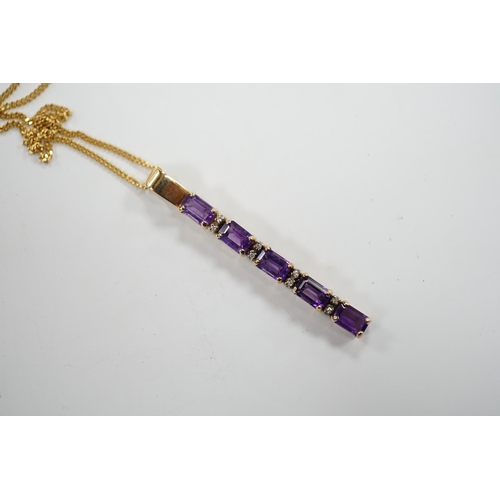 964 - A modern yellow metal, amethyst and diamond chip set line pendant, 47mm, on an 18ct gold fine link c... 