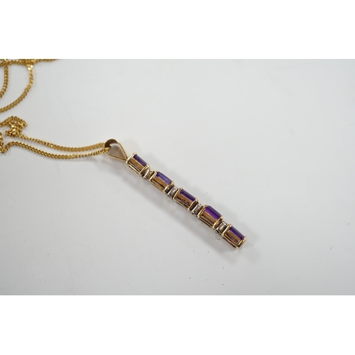 964 - A modern yellow metal, amethyst and diamond chip set line pendant, 47mm, on an 18ct gold fine link c... 