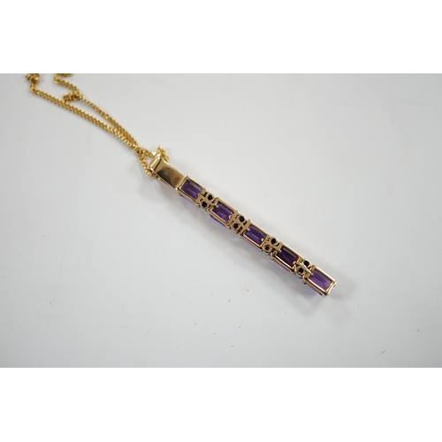 964 - A modern yellow metal, amethyst and diamond chip set line pendant, 47mm, on an 18ct gold fine link c... 