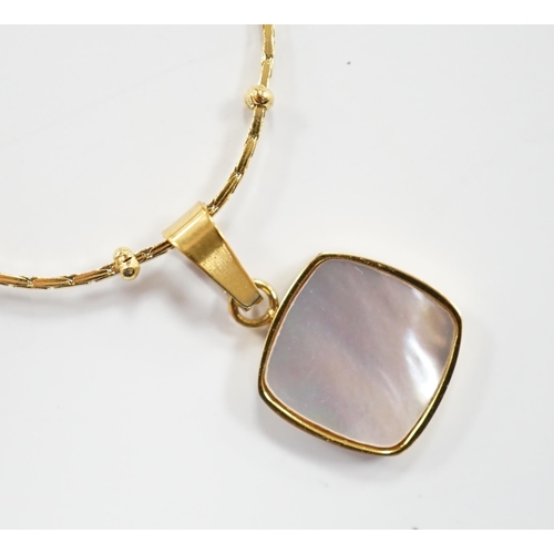 969 - A yellow metal and mother of pearl inset pendant, 11mm on a 18kt fine link chain, 42cm, gross weight... 