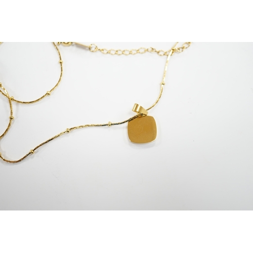 969 - A yellow metal and mother of pearl inset pendant, 11mm on a 18kt fine link chain, 42cm, gross weight... 