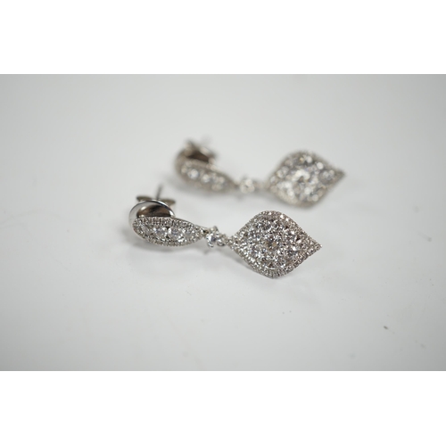 970 - A modern pair of 750 white metal and diamond cluster set drop earrings, of elliptical form, 26mm, gr... 