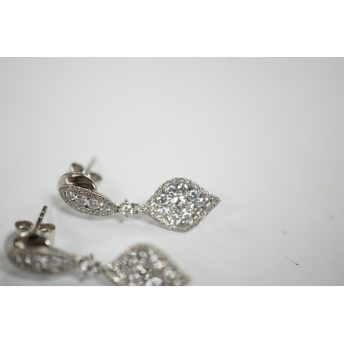 970 - A modern pair of 750 white metal and diamond cluster set drop earrings, of elliptical form, 26mm, gr... 