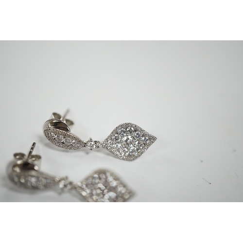 970 - A modern pair of 750 white metal and diamond cluster set drop earrings, of elliptical form, 26mm, gr... 