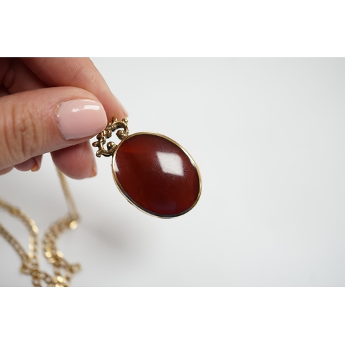 974 - A modern 9ct gold mounted carnelian and bloodstone set oval 'Millennium' pendant, by Davis Scott Wal... 