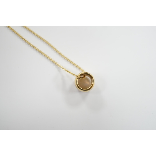 976 - A modern Georg Jensen two colour 18ct gold barrel pendant, 10mm, on a Georg Jensen 18ct gold fine li... 