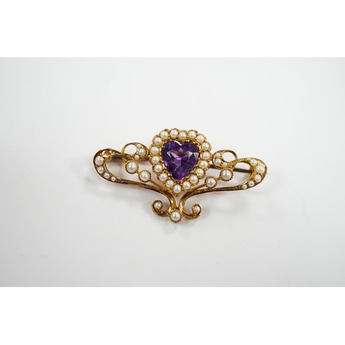 979 - An Edwardian 15ct?, amethyst and seed pearl cluster set bar brooch, with central heart motif, 38mm, ... 