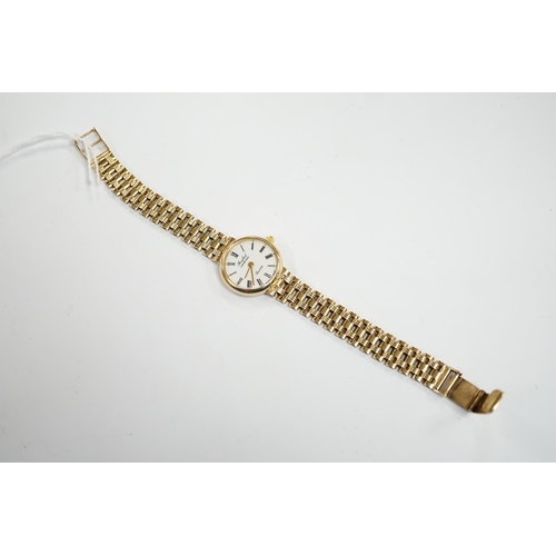 985 - A lady's modern 9ct gold quartz bracelet wrist watch, retailed by Brufords, overall 17.7cm, gross we... 