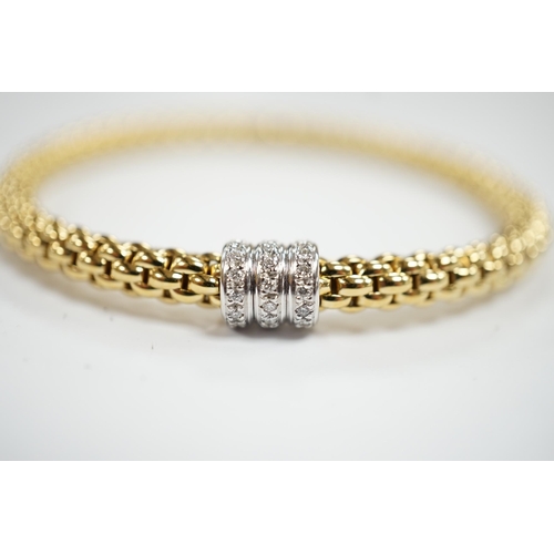 986 - An Italian 18kt Fope flexible bracelet, with diamond chip set barrel shaped motif, gross weight  17.... 