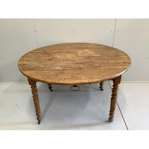 111 - A 19th century French oak drop flap dining table, width 124cm, depth 76cm, height 73cm