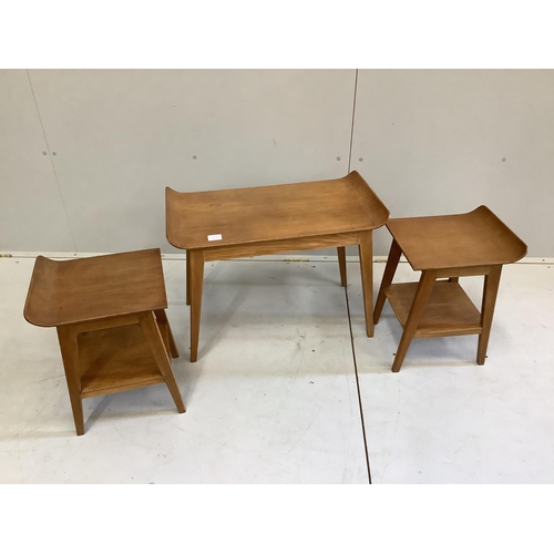 119 - An oak nest of three mid century oak tea tables, width 67cm, depth 38cm, height 49cm