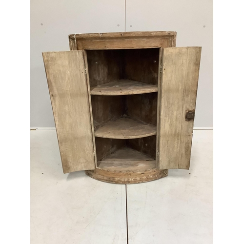 130 - An 18th century oak bow front hanging corner cupboard, width 56cm, depth 38cm, height 91cm