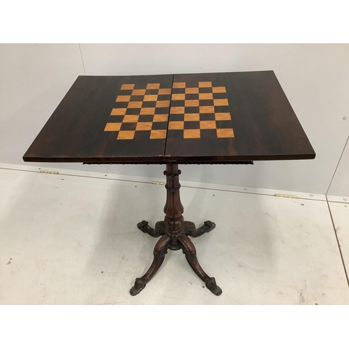 145 - An early Victorian rectangular rosewood folding games table, width 50cm, depth 35cm, height 75cm... 