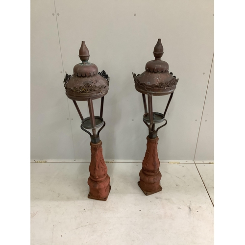 149 - A pair of Victorian copper and cast iron lamps, height 122cm