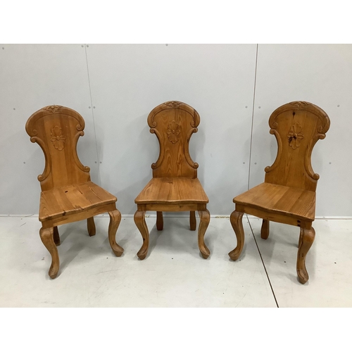 150 - Three Victorian style carved pine hall chairs, height 96cm