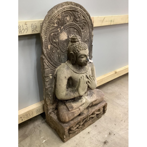 170 - A South East Asian carved stone Buddha, width 39cm, height 79cm