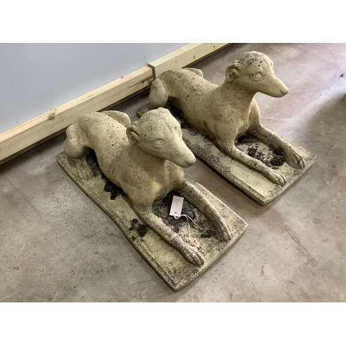 171 - A pair of stone recumbent hound garden ornaments, length 70cm, width 30cm, height 34cm