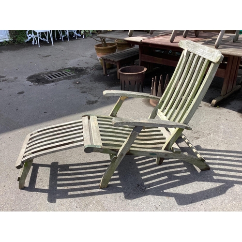 175 - A brass mounted weathered teak steamer garden chair