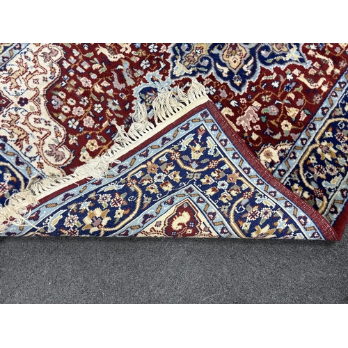 187 - A North West Persian red ground rug, 150 x 94cm