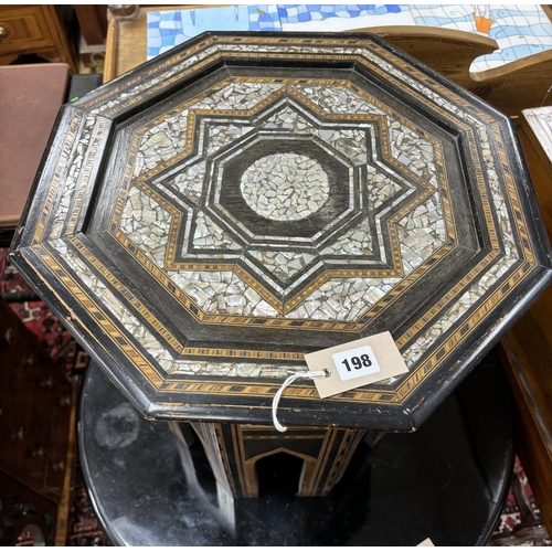 198 - A Moorish octagonal mother of pearl inlaid occasional table, width 46cm, height 51cm