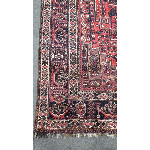 201 - A Persian Shiraz carpet, 300 x 210cm