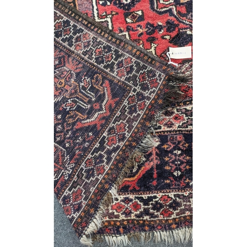 201 - A Persian Shiraz carpet, 300 x 210cm