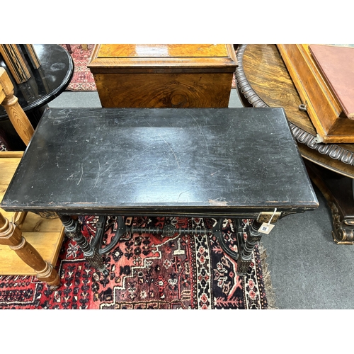 203 - A late Victorian aesthetic movement ebonised folding card table, width 92cm, depth 44cm, height 76cm... 