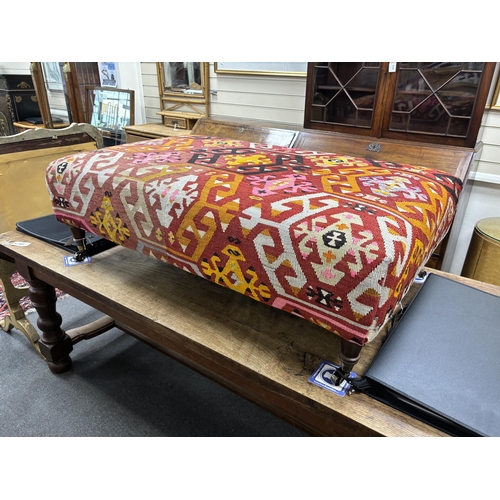 206 - A large contemporary rectangular footstool with antique polychrome Kilim upholstery on turned beech ... 