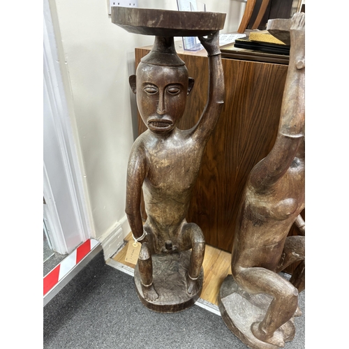 225 - A pair of Sarawak carved hardwood figures. height 85cm