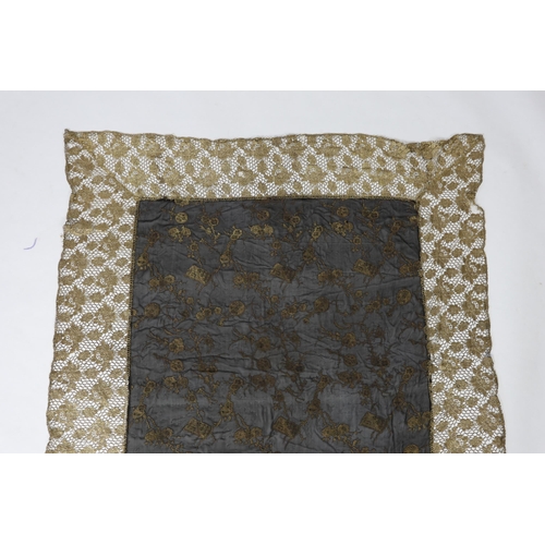 259 - An unusual 1920's gold lace and black silk chiffon gold brocade boudoir cover, 140 x116cm