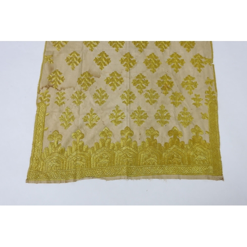 260 - An early 20th century North Indian cotton yellow silk hand embroidered panel, with wide embroidered ... 