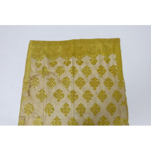 260 - An early 20th century North Indian cotton yellow silk hand embroidered panel, with wide embroidered ... 