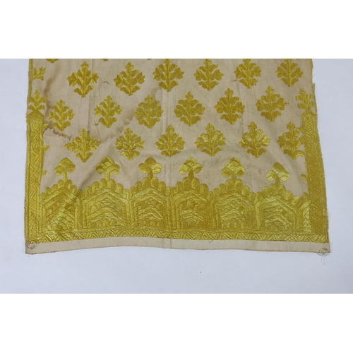 260 - An early 20th century North Indian cotton yellow silk hand embroidered panel, with wide embroidered ... 