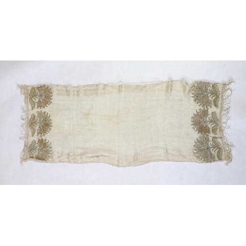 266 - A 19th century Turkish towel, embroidered with flower motifs, in pastel shades, with fine silk fring... 