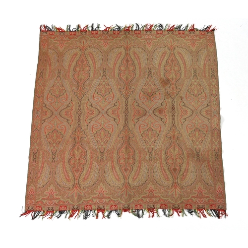 276 - An 1860s, reversible woven wool Paisley shawl, woven with green, red, ochre and brown, with a woven... 