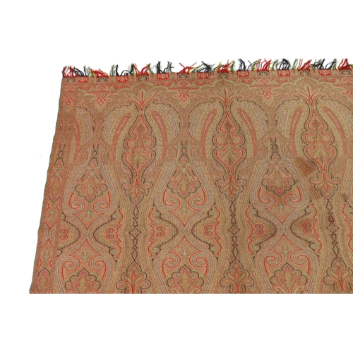 276 - An 1860s, reversible woven wool Paisley shawl, woven with green, red, ochre and brown, with a woven... 