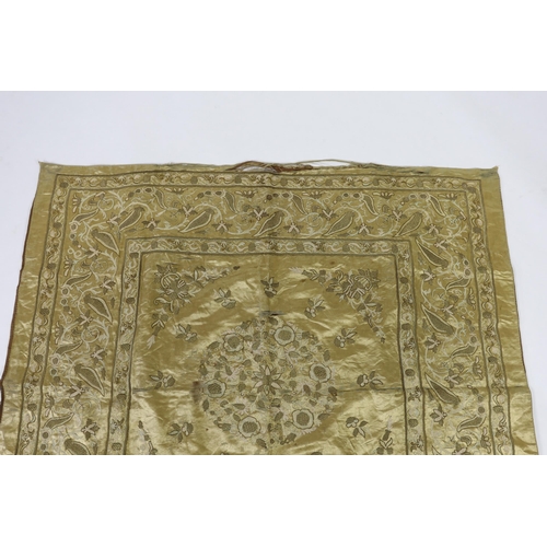 286 - A late 19th century Turkish metallic thread and chain stitch silk satin cover, embroidered with a ce... 