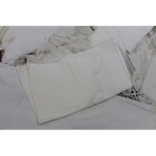 297 - 19th-20th century bed linen; a monogrammed sheet, 7ft 6in., and a smaller crochet edged sheet, a pai... 