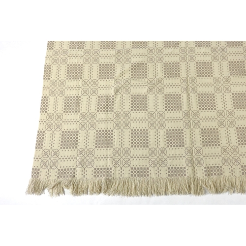 299 - A Welsh wool woven blanket, using mushroom and cream wool in a reversible geometric design, 192cm wi... 