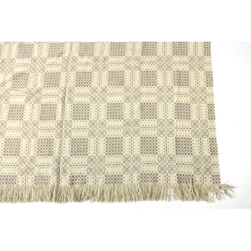 299 - A Welsh wool woven blanket, using mushroom and cream wool in a reversible geometric design, 192cm wi... 