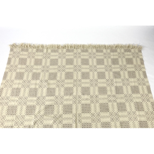 299 - A Welsh wool woven blanket, using mushroom and cream wool in a reversible geometric design, 192cm wi... 