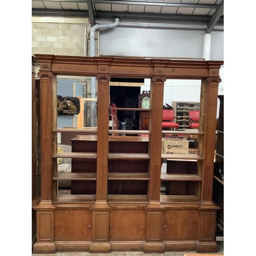 3 - A pair of mid 20th century Sheraton style pitch pine and ply open bookcases, the adjustable shelves ... 