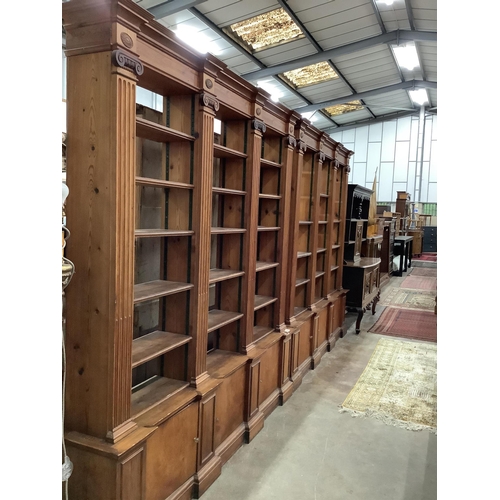 3 - A pair of mid 20th century Sheraton style pitch pine and ply open bookcases, the adjustable shelves ... 