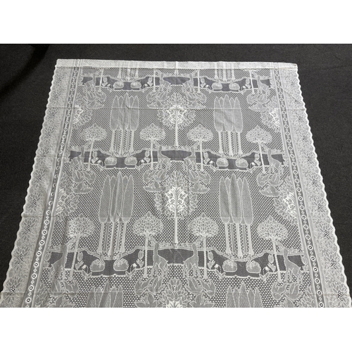 304 - A set of three C.F.A. Voysey design The Stag, machine made, cotton lace curtains manufactured by R... 