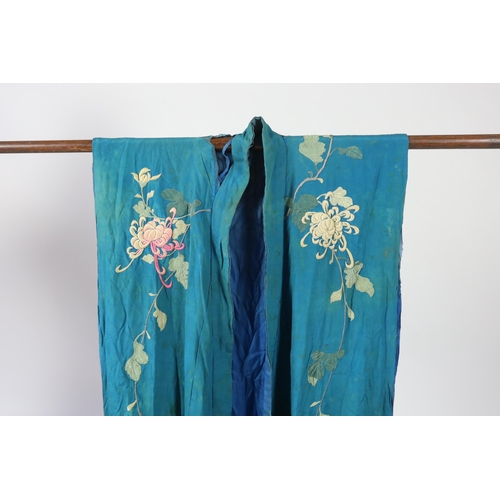 305 - An early 20th century silk crêpe Japanese kimono and fringed tie belt, the back panel heavily embroi... 