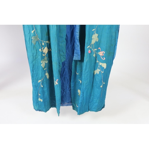 305 - An early 20th century silk crêpe Japanese kimono and fringed tie belt, the back panel heavily embroi... 