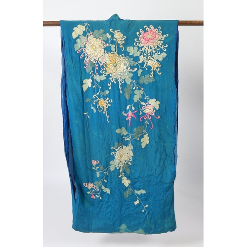 305 - An early 20th century silk crêpe Japanese kimono and fringed tie belt, the back panel heavily embroi... 