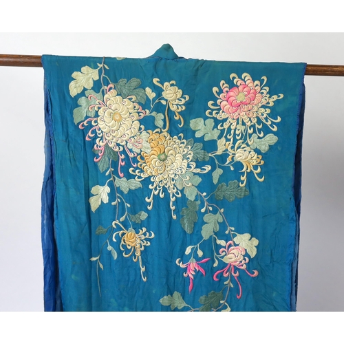 305 - An early 20th century silk crêpe Japanese kimono and fringed tie belt, the back panel heavily embroi... 